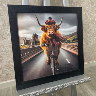 Highland Cow on a Bicycle Wall Art with Black Frame